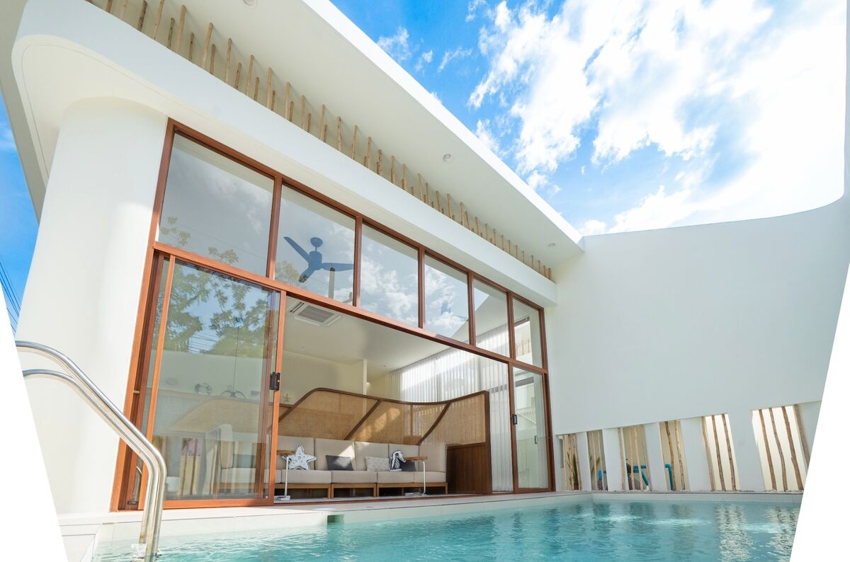 A private pool villa at SandScape at dusk